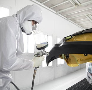 Collision Center Technician Painting a Vehicle | Toyota Smithfield in Smithfield RI